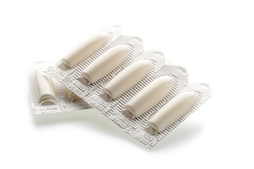 Vaginal suppository tablet in plastic strip pack