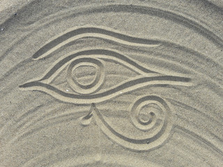 Fototapeta na wymiar ra eye design on the sand