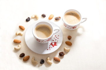 Two cups of coffee with nuts