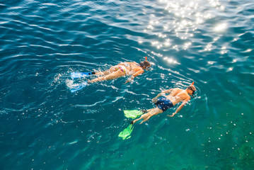 Two people snorkling in Adriatic Sea - obrazy, fototapety, plakaty