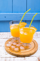 Segment of orange and juice in a glass the orange