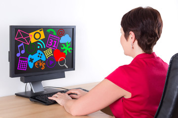 businesswoman using pc with media icons and applications