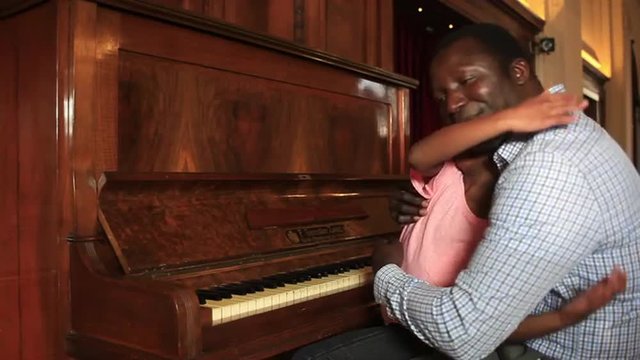 Father and daugther hugging and smling