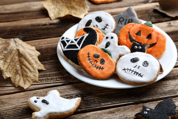 Fresh halloween gingerbread cookies on brown wooden table