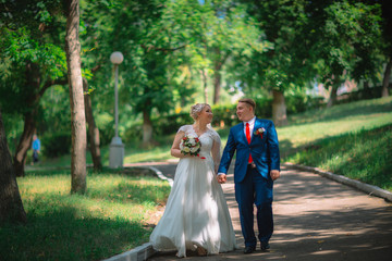 Fototapeta premium beautiful young couple stand on background forest