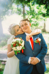  beautiful young couple stand on background forest