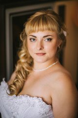 Portrait of bride on the classic bright background