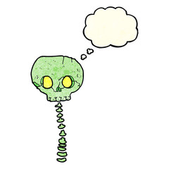 cartoon spooky skull and spine with thought bubble
