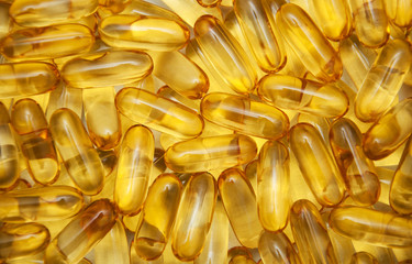 background of yellow translucent pills - obrazy, fototapety, plakaty