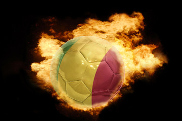 Fototapeta na wymiar football ball with the flag of mali on fire