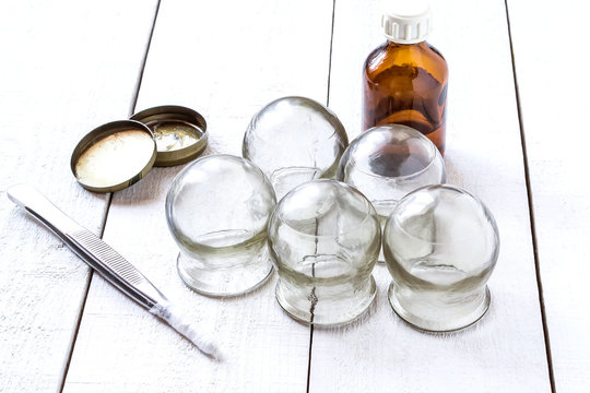 Old medical cupping glass, the alcohol, petrolatum and tweezers