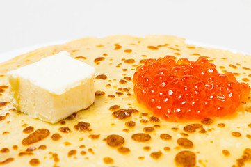 some pancakes on the white plate with red caviar