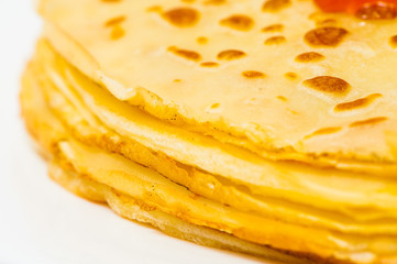 some pancakes on the white plate