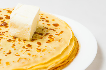 some pancakes on the white plate