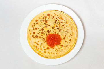 some pancakes on the white plate with red caviar