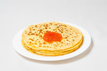 some pancakes on the white plate with red caviar
