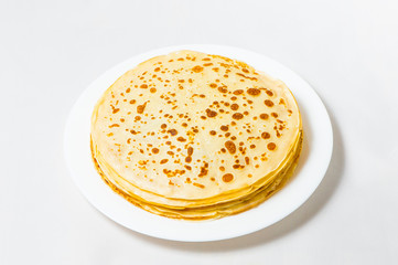some pancakes on the white plate