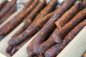 Homemade delicious smoked sausages in market. Traditional food