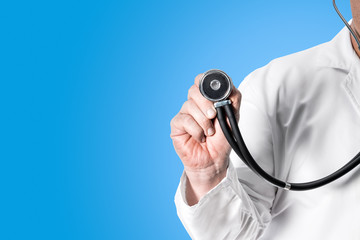 Doctor holding stethoscope in hand