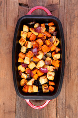 root veg mixed cooked shot from above on wooden boards