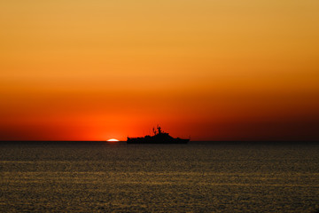 russian coast guard ship at sunset