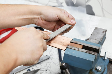 Grinding the copper billet with a file