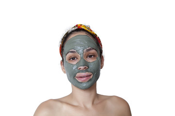 Beautiful young Brazilian model with green clay facial mask