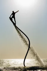 Fotobehang Silhouet van een hoverboard-rijder © Mrakor
