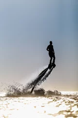 Acrylic prints Water Motor sports Silhouette of a fly board rider