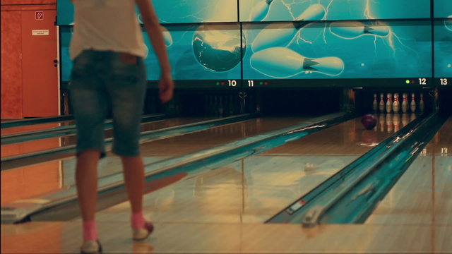 Girl playing bowling