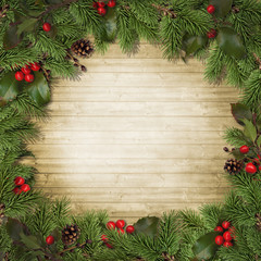 Fototapeta na wymiar Christmas tree branches and holly on wooden board