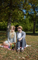 Beautiful Young Couple Having Picnic in Countryside. Happy Famil