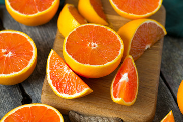red oranges on wooden surface
