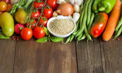 Quinoa in a bowl and fresh vegetables