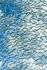 Cloudy sky view through broken glass