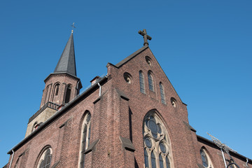 catholic church in Hilden with weathercock and cross