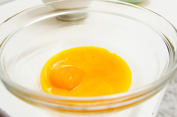 glass bowl with yolks of eggs