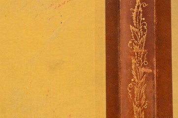 Back of vintage book. Fine-grained motive with golden texture.