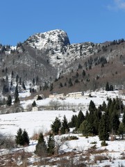 high mountain peak with snow in winter
