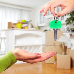 Hand with house key.