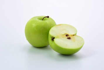 Ripe green apple and slice on white background