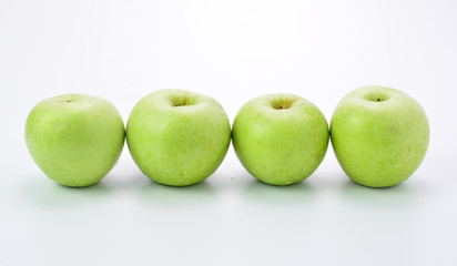 Green apples on white background