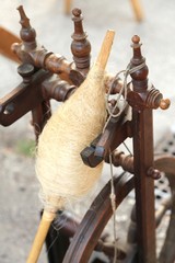 old spinning wheel and a spindle