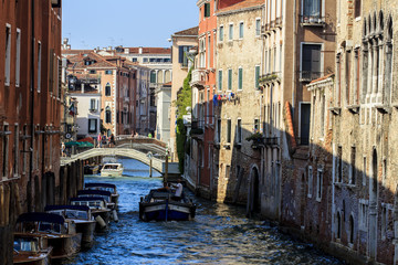 Canal in Venice with gondolas, Italy