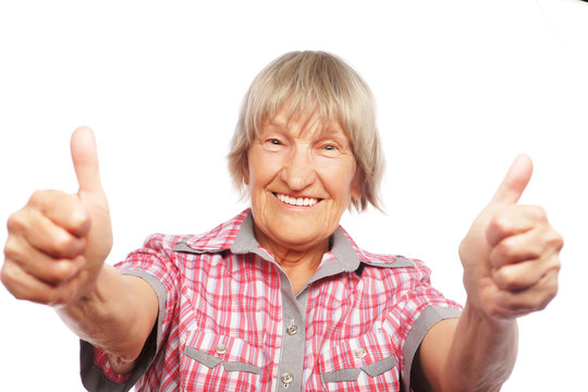 Old Woman Showing Ok Sign On A White Background