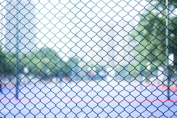 Fototapeta premium wire net around the basketball court background