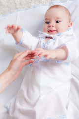 Baby boy touching his mother&amp;amp;#39;s hand