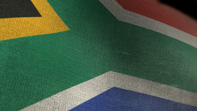 A closeup of a south African flag waving in the wind