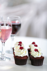 Tasting of wine and chocolate cupcakes, close up