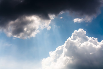 A rays of light shining throug dark clouds
